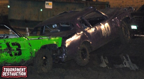 Mean Green Machines' Ryan Decker pushes Full Throttle's Ron Johnston onto the wall